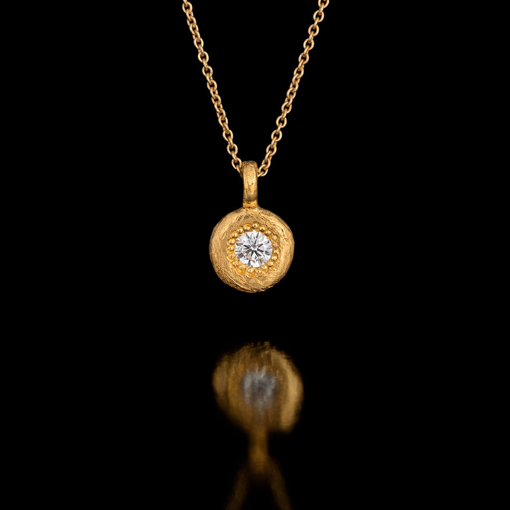 Diamond set in a thick Gold Pendant