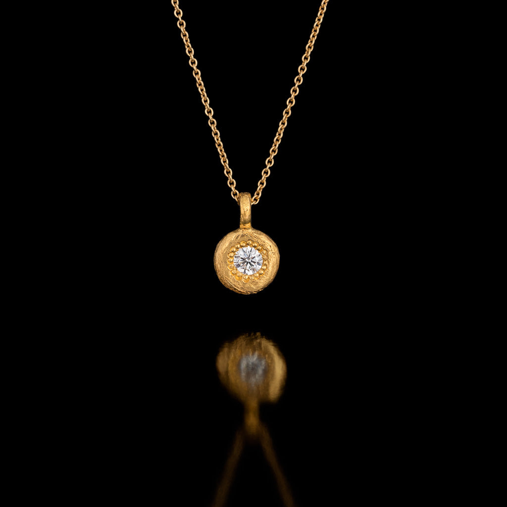 Diamond set in a thick Gold Pendant