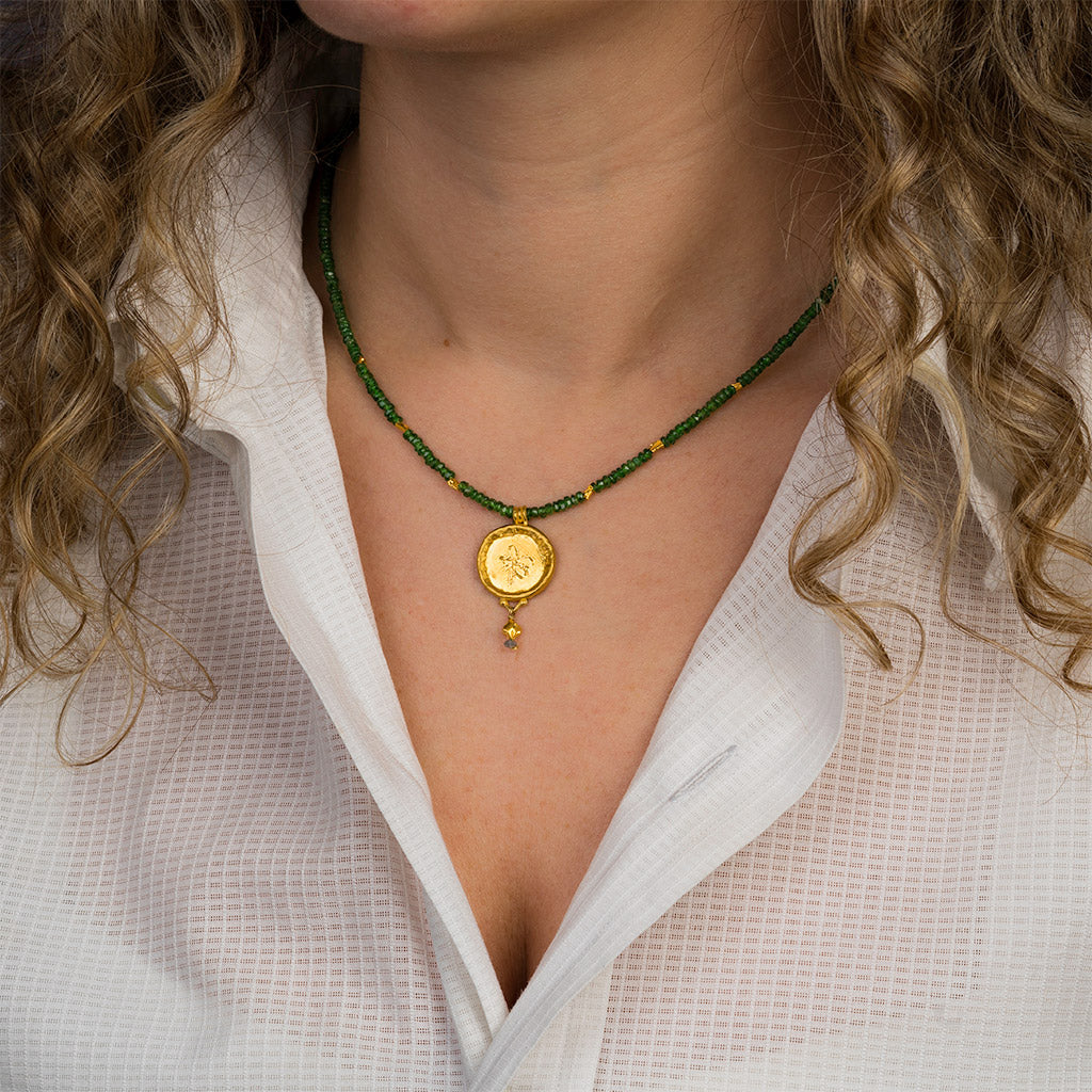 Tsavorite Necklace with a Gold Circle Pendant